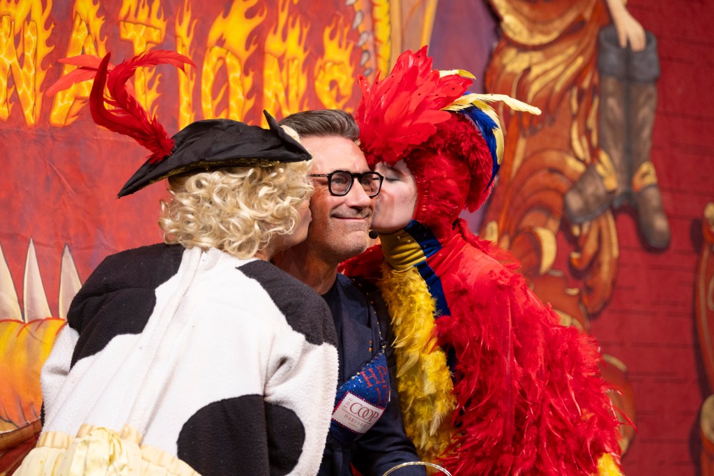 Ava Pallotta and Jessica Zisk kiss Hasty Pudding Man of the Year Jon Hamm during his roast in Farkas Hall.