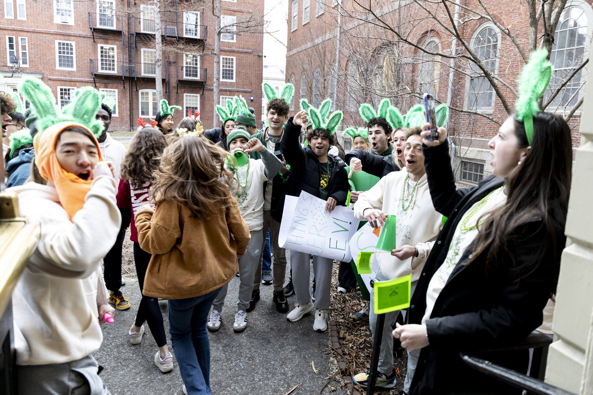 Leverett House students boo Dunster House residents as they exit a first-year dorm.