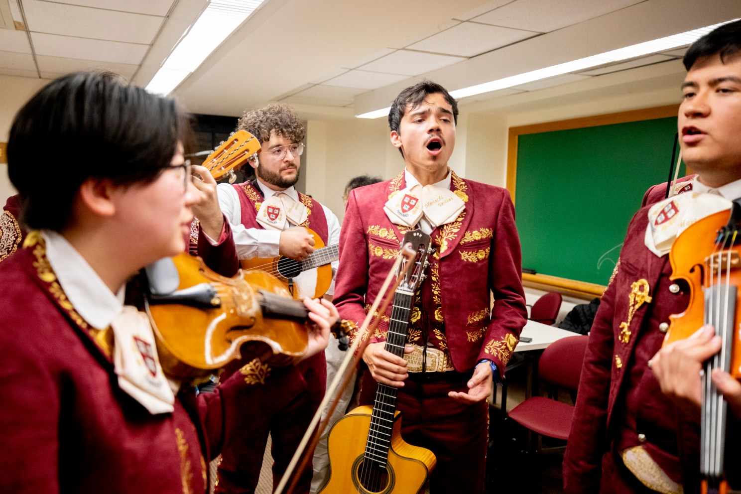 Sebastian Feune (center right) rehearses with other members of Mariachi Véritas i
