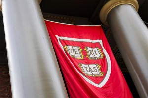 A veritas shield hangs above the entrance to Memorial Church in Harvard Yard.