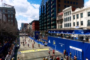 Runners cross the finish line of the 2024 Boston Marathon.
