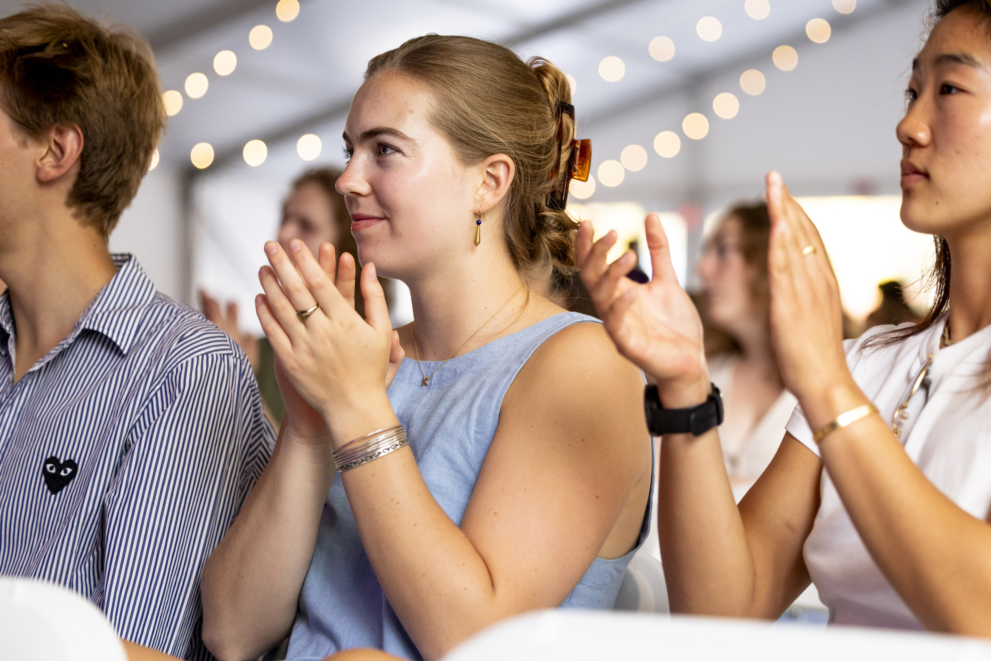 Paton Roberts '25 claps for the Charles Revival and Friends performance at the Science Center Plaza tent.