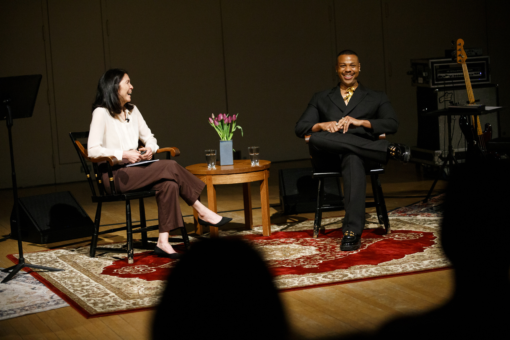 Operatic bass-baritone Davóne Tines ’09 smiles during a conversation with Diane Paulus, Terrie and Bradley Bloom Artistic Director at American Repertory Theater.