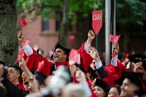 Graduates celebrate as their School is announced.