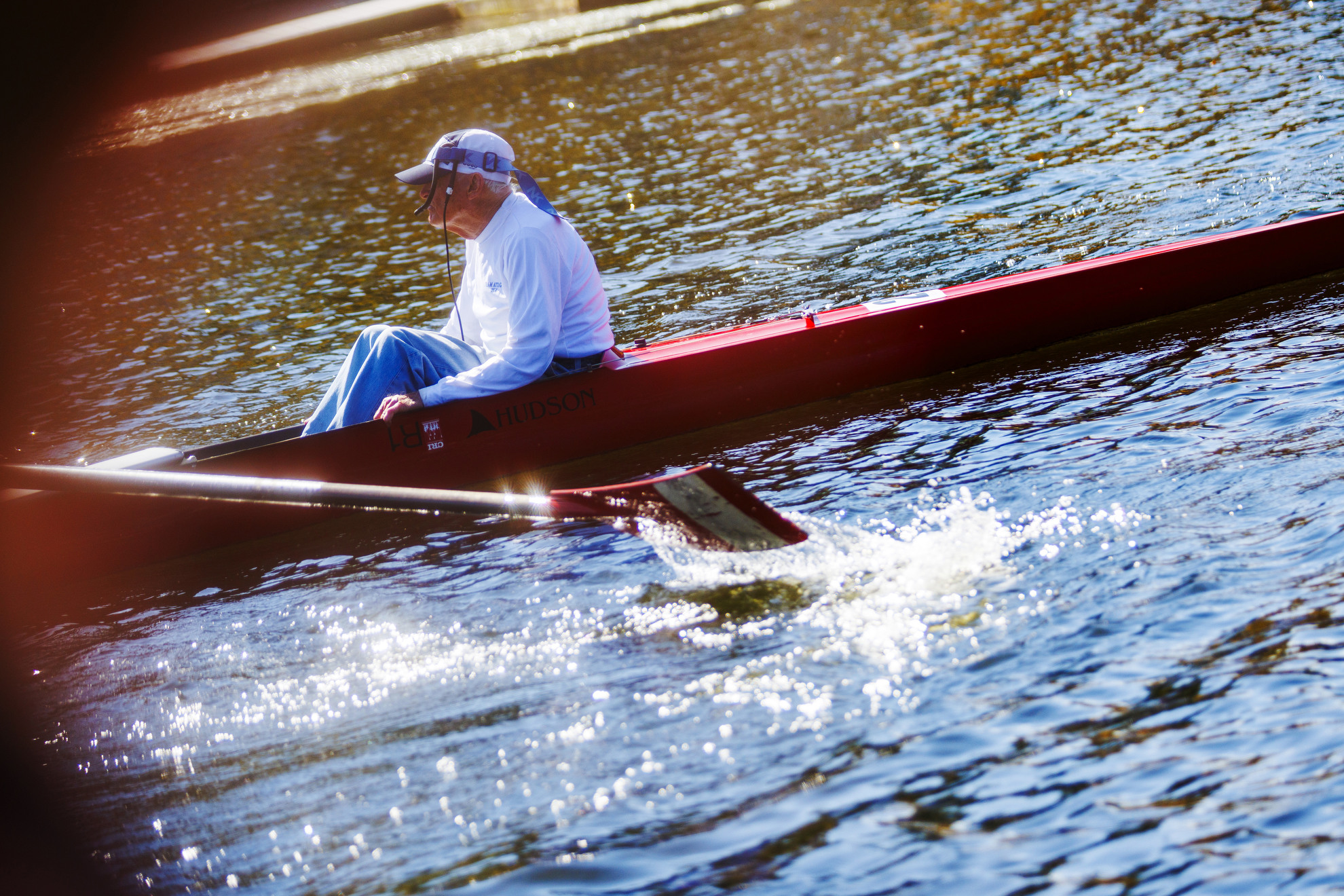 Bill Becklean, the 89-year-old coxswain for the Octo Eight, is pictured on the Charles River.
