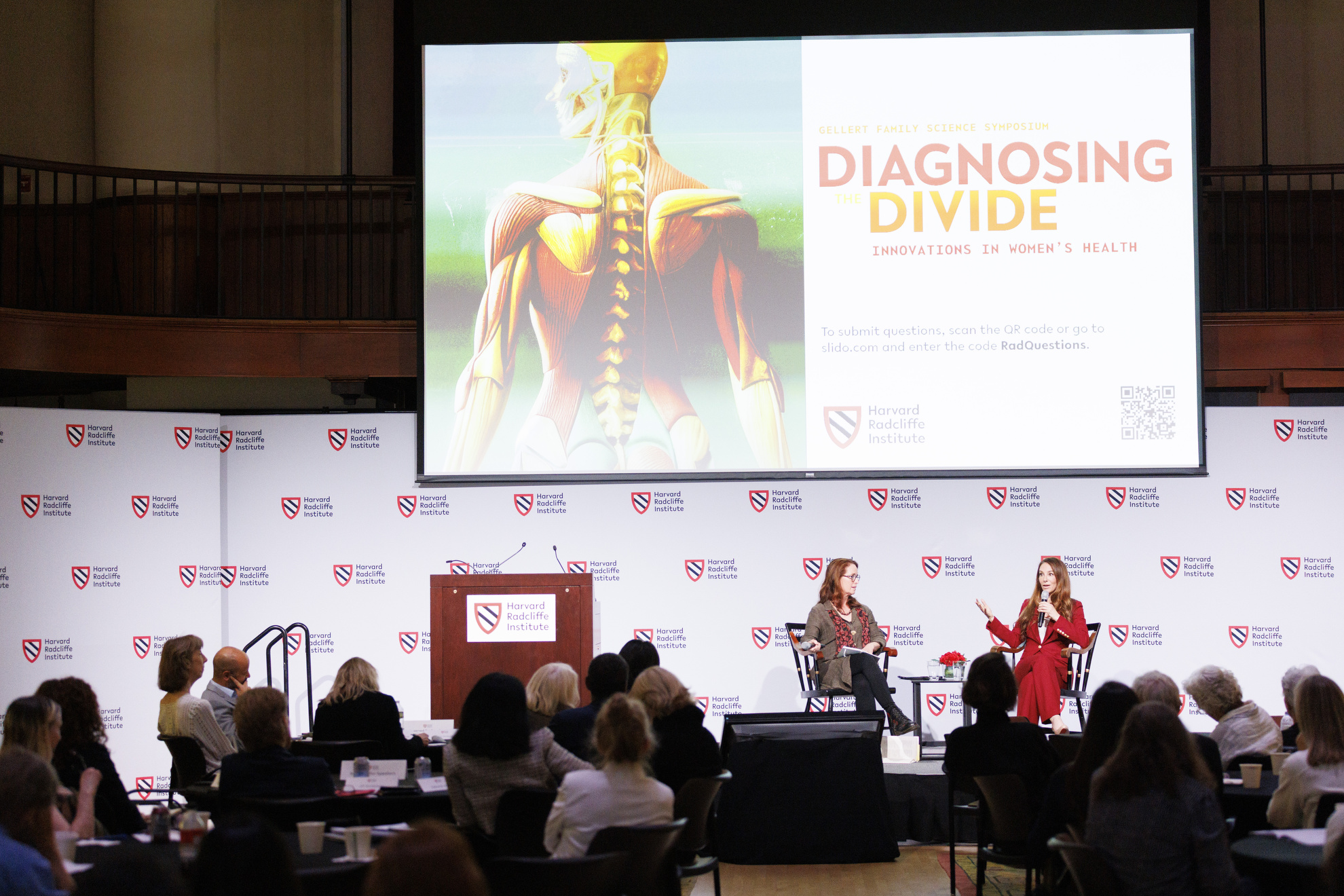 Elizabeth Comen speaking with Janet Rich-Edwards onstage at Radcliffe.