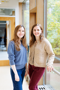 Jessica Whited and Duygu Payzin-Dogru stand together by a window.