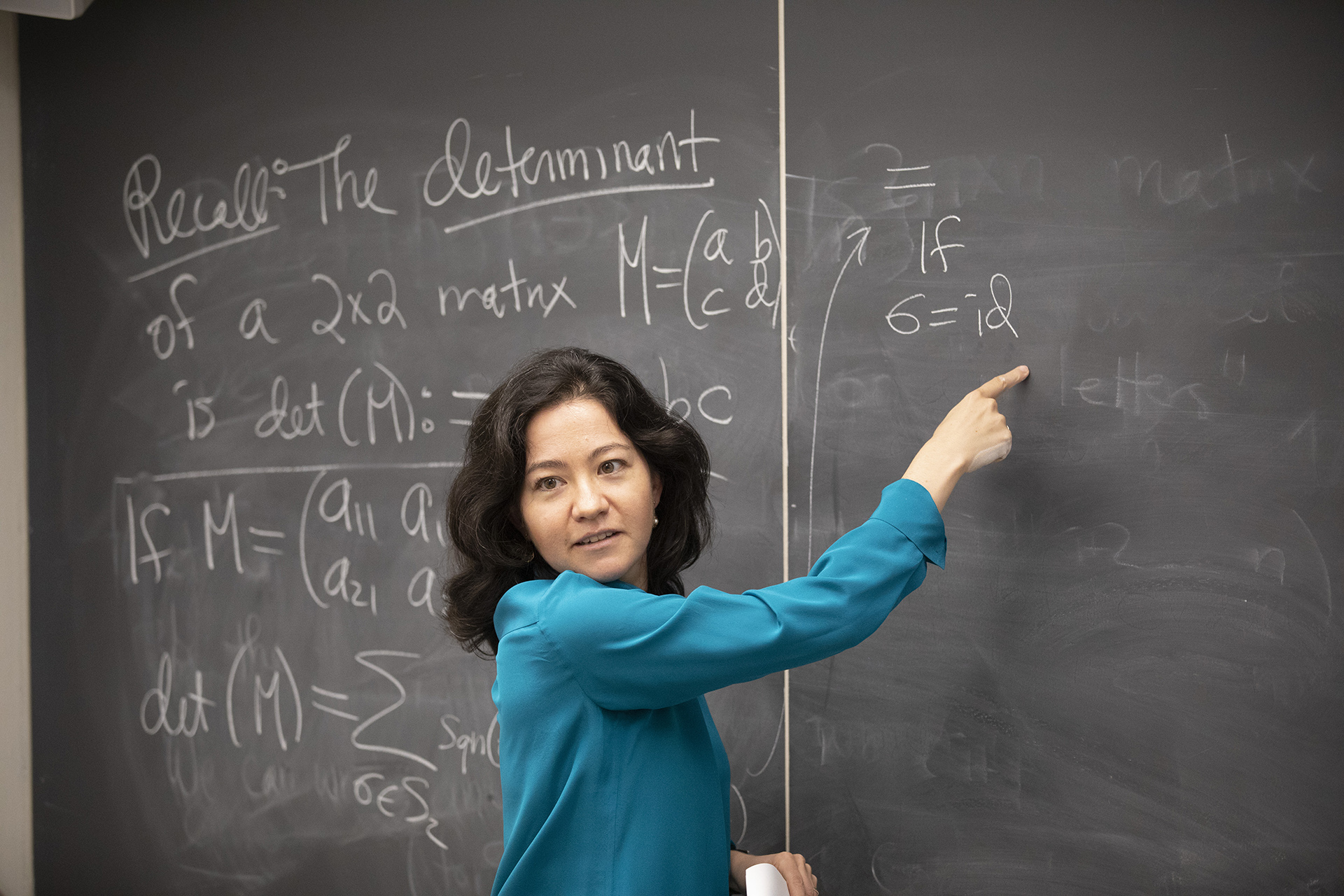 Lauren Williams at blackboard during class.