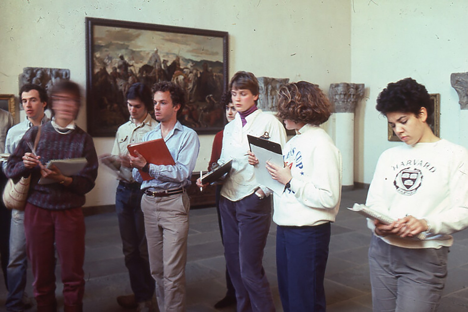 Students from 1970s or 1980s taking notes and viewing art.