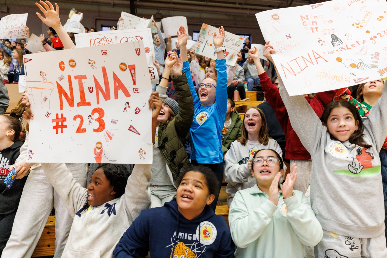 Students from Cambridge’s Amigos School cheer during a Harvard Crimson women’s basketball game as part of Education Day 2025.