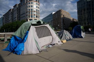 Homeless encampments are seen near Washington Circle.