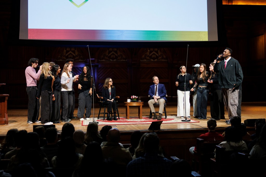The Harvard Opportunes giving a surprise performance for Tina Fey (center left) and Robert Carlock ’95.