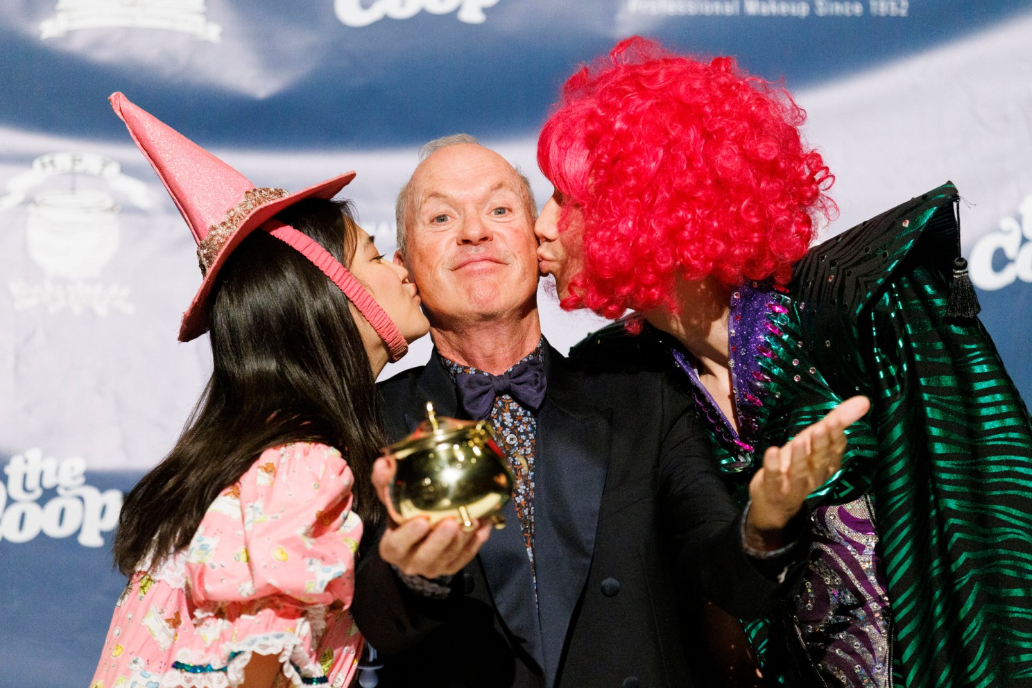 Michael Keaton with his pudding pot and getting kisses.