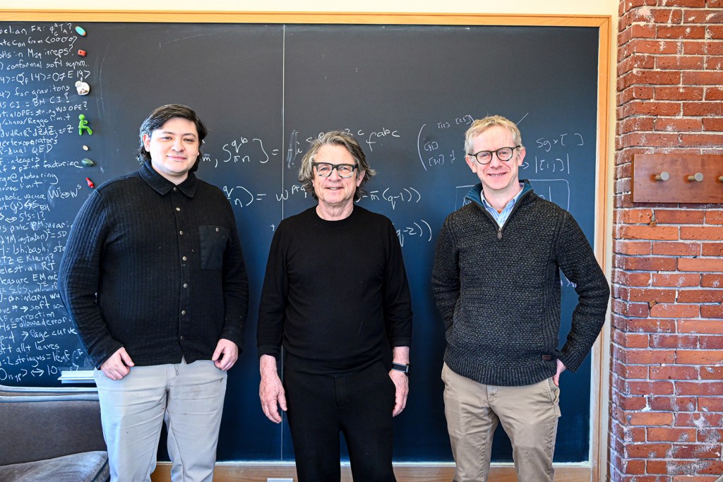Alfredo Guevara, Andrew Strominger, and David Skinner in front of a chalkboard.