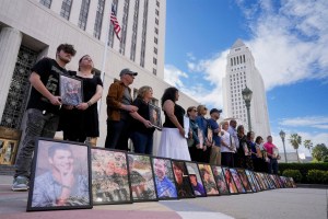 Parents of children who have died due alleged social media harms hold photos of their at the Los Angeles Superior Courthouse.
