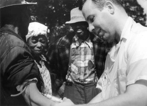 Doctor drawing blood from a patient as part of the Tuskegee Syphilis Study.