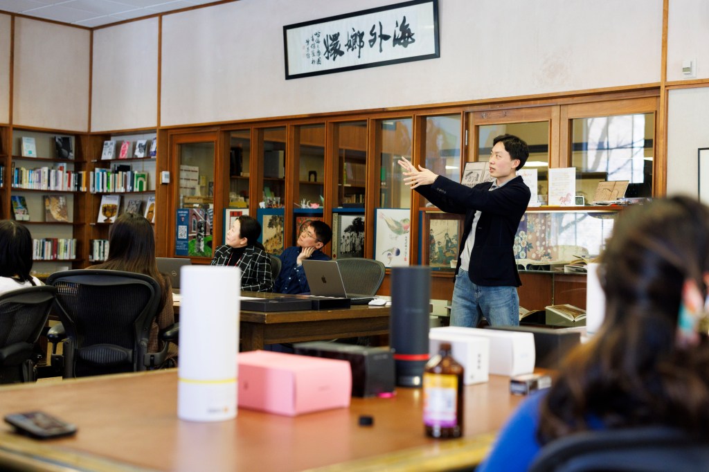 Chan Yong Bu, an assistant professor of East Asian Languages and Civilizations, discusses K-pop fandom during a class visit to the Harvard-Yenching Library.