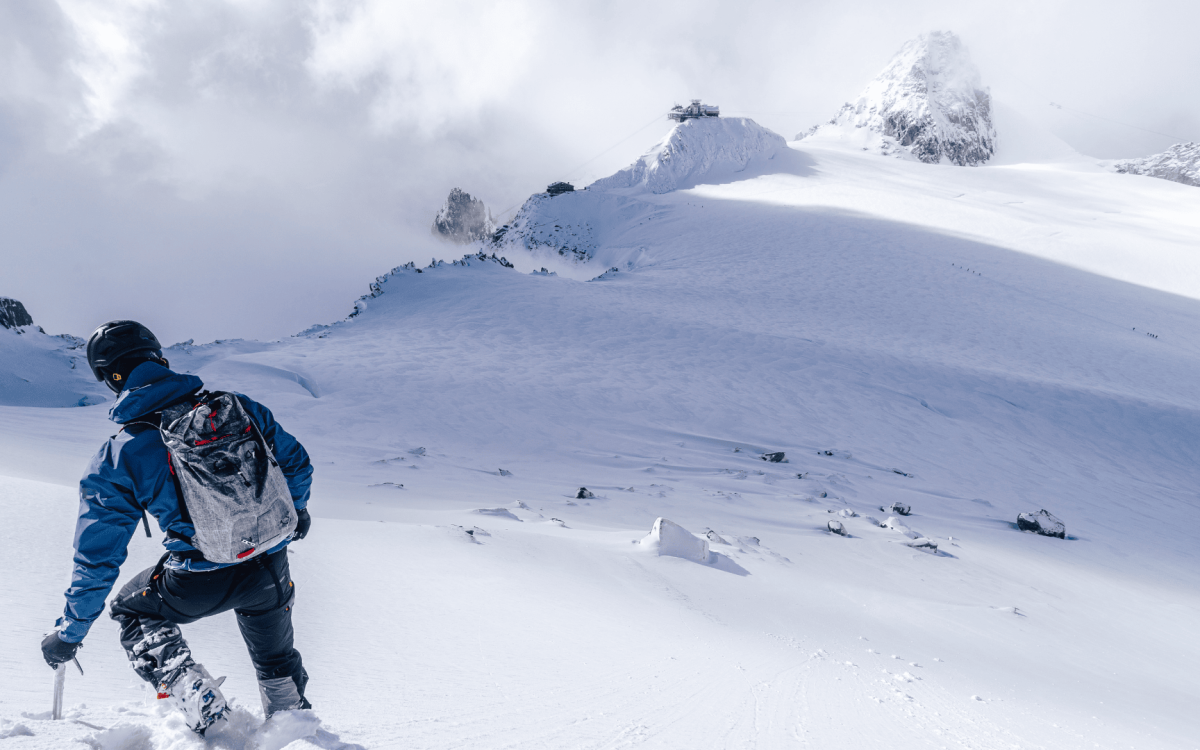 a person climbing a snowy mountain